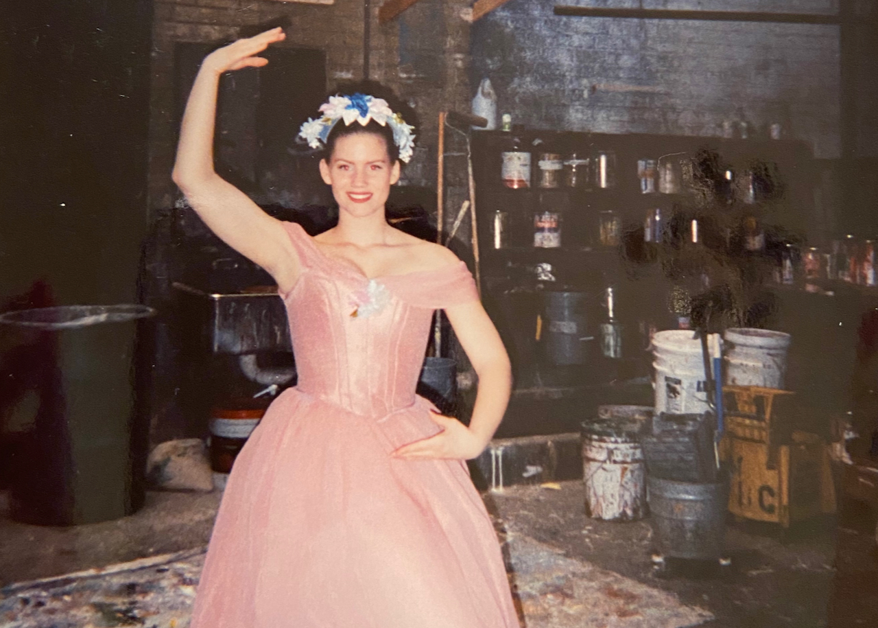 Kara striking a ballet pose in a pink tutu during her acting days.